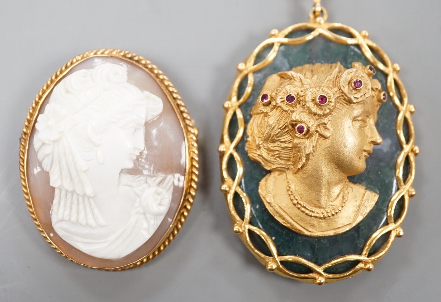 A 9ct gold and ruby mounted moss agate oval pendant with applied bust of a lady 52mm, moss agate cameo and a modern 9ct gold mounted oval cameo shell brooch, gross weight 47.6 grams.